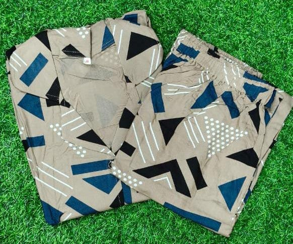 Folded fabric with geometric pattern on a grass background
