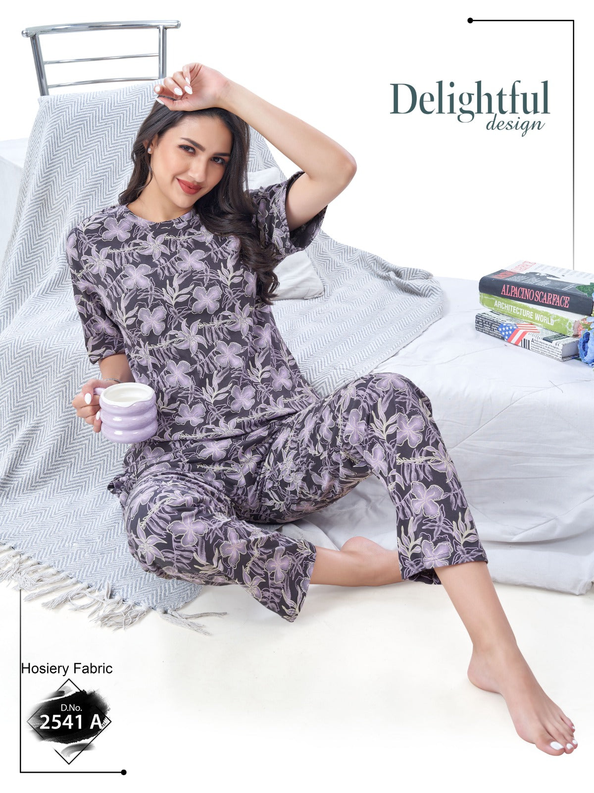 Woman in a floral pajama set sitting on a bed with 'Delightful Design' branding.
