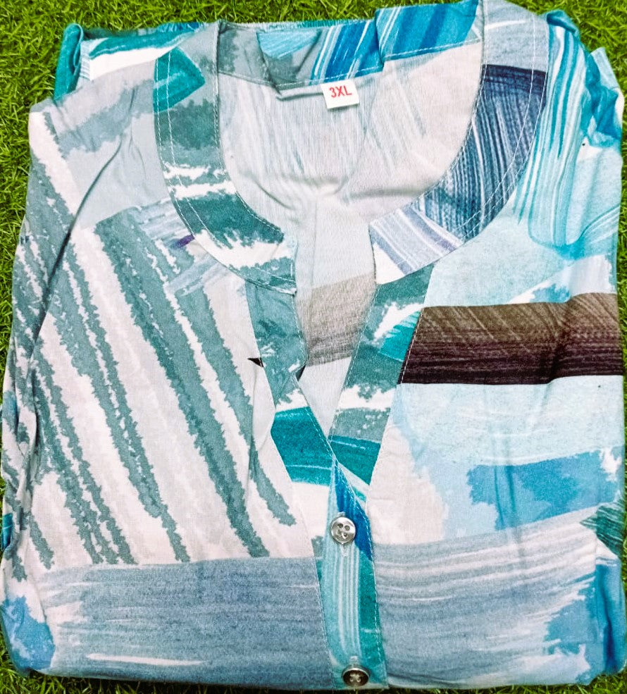 Patterned shirt on grass with size label visible