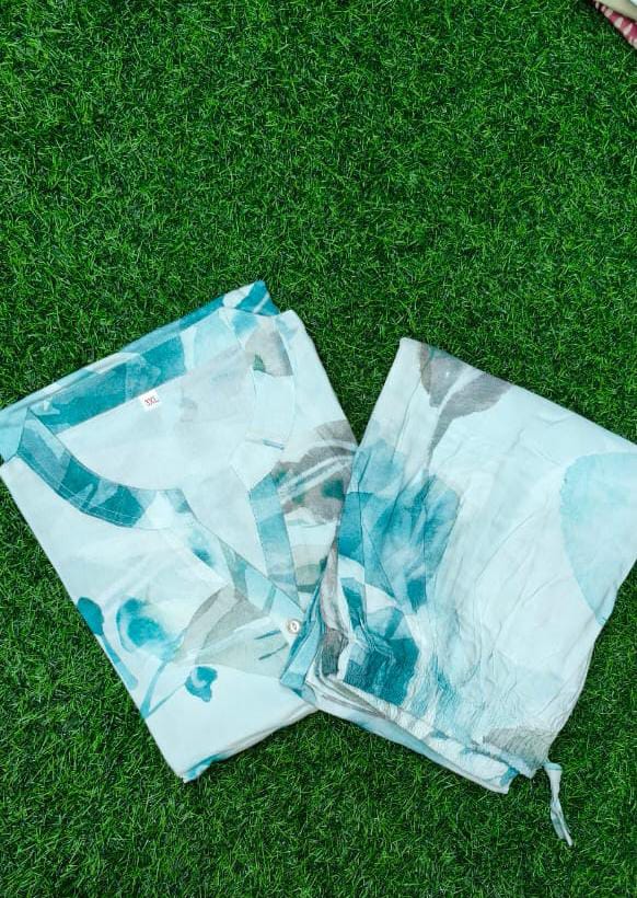 Two baby blankets with watercolor patterns on a green grass background