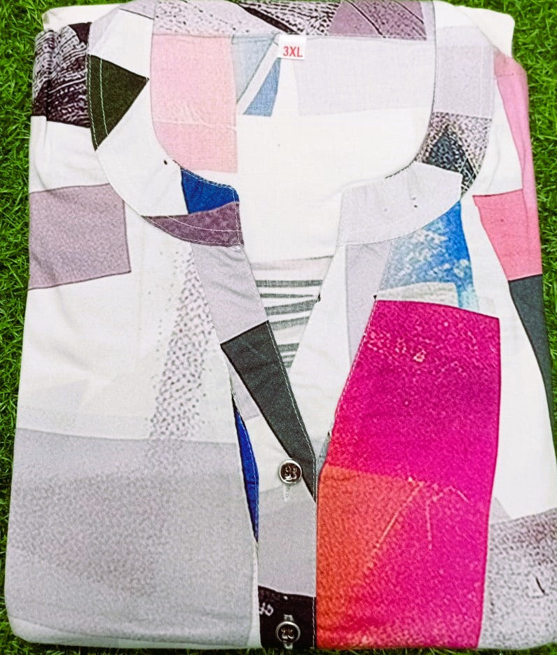 Colorful geometric-patterned shirt on a grass background