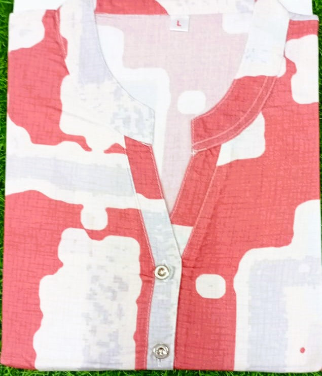 Red and white checkered shirt with a collar on a grass background