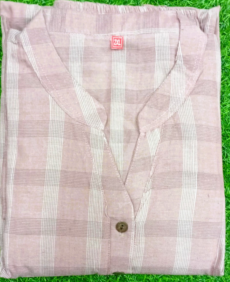Pink and white striped shirt on a green grass background