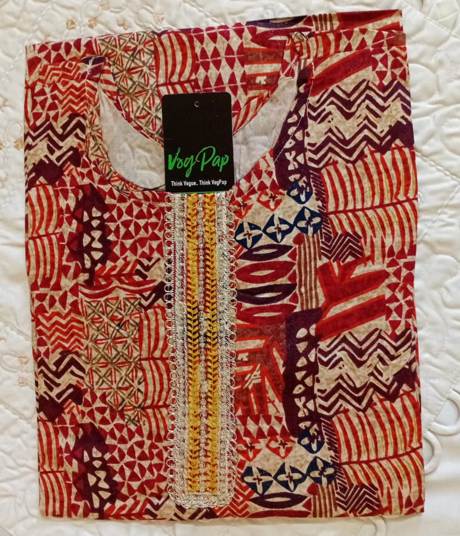 Traditional patterned fabric with a visible brand label on a textured white background