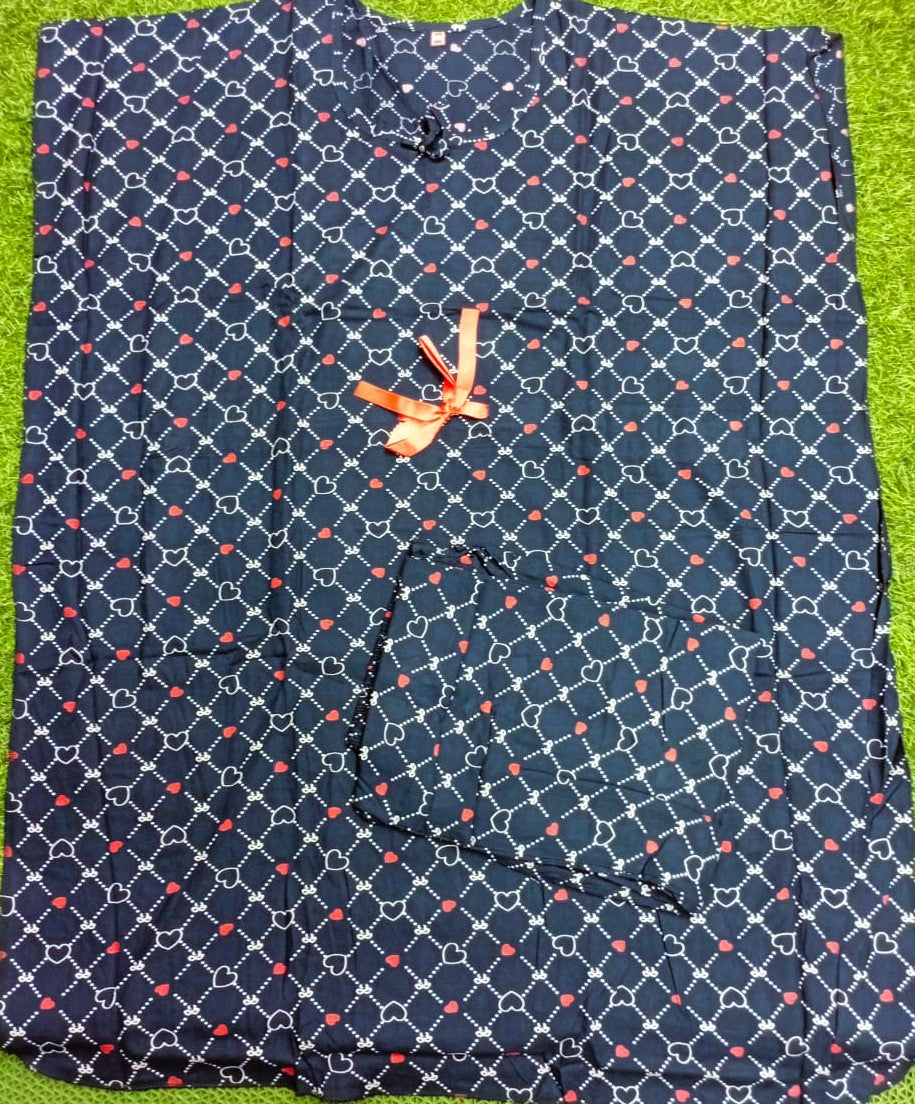 Navy blue shirt with pink geometric pattern on a green background