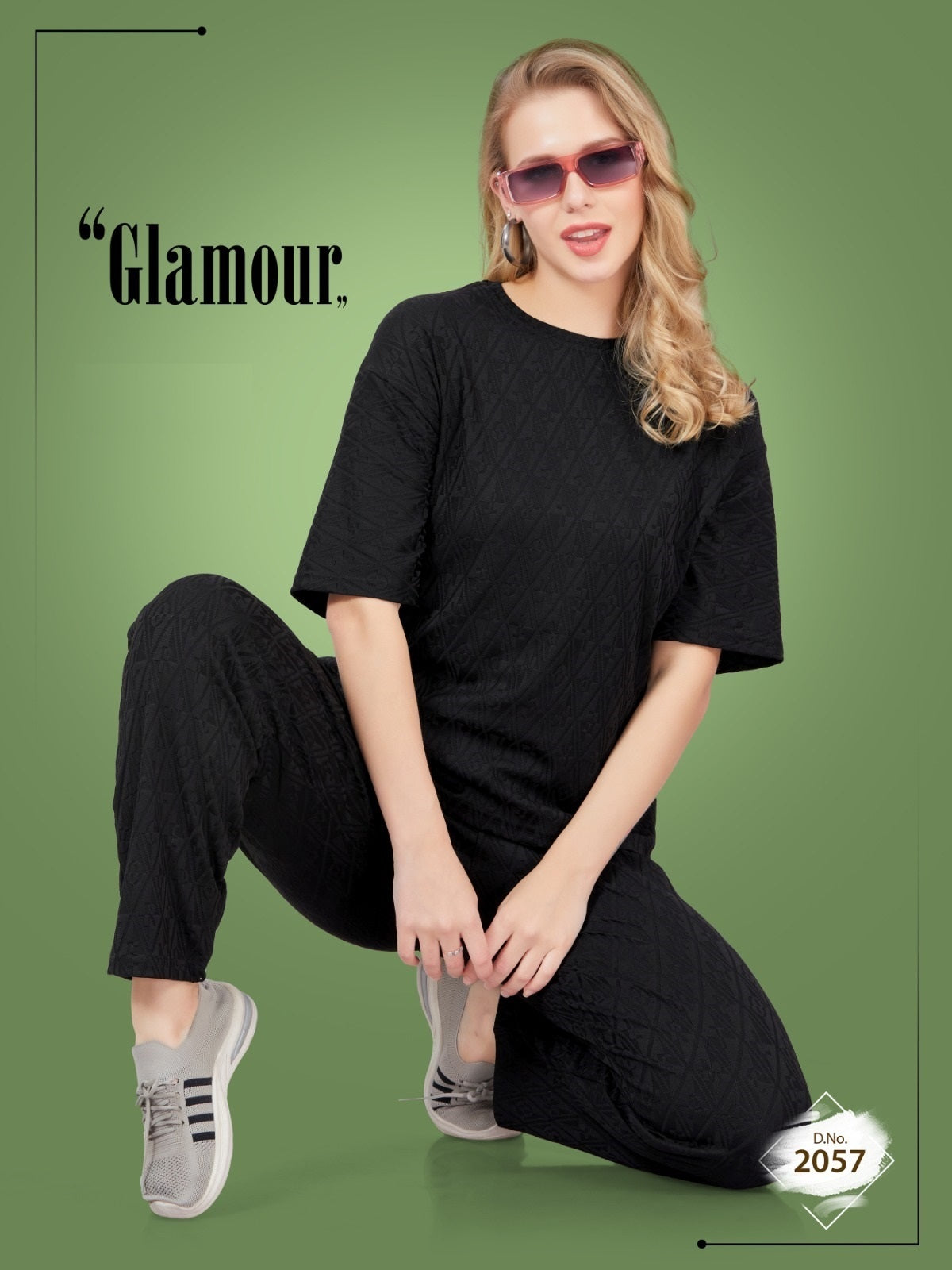 Woman in black outfit with sunglasses on a green background, featuring the word 'Glamour'.