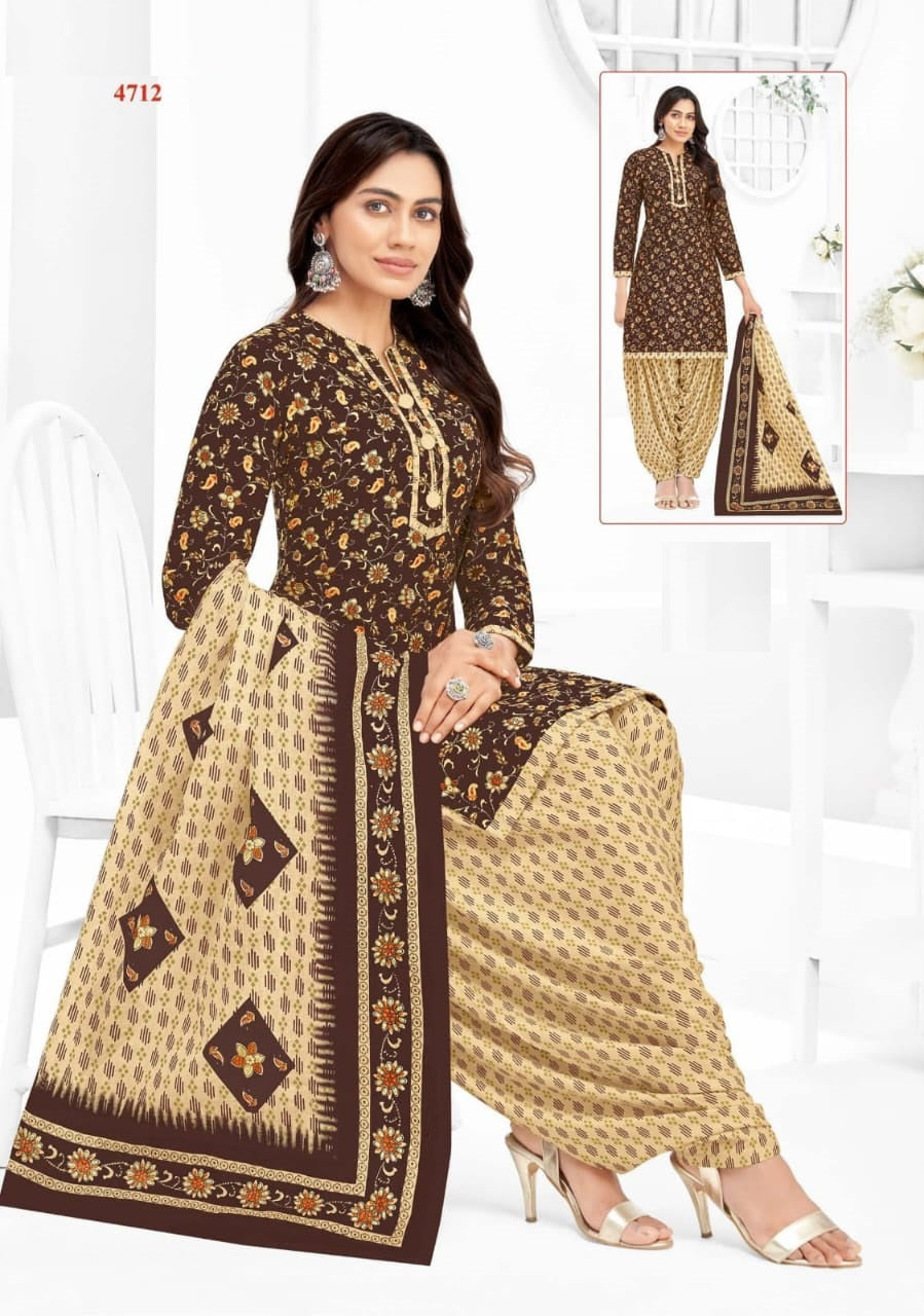 Woman wearing a brown and beige patterned outfit with matching dupatta on a white background.