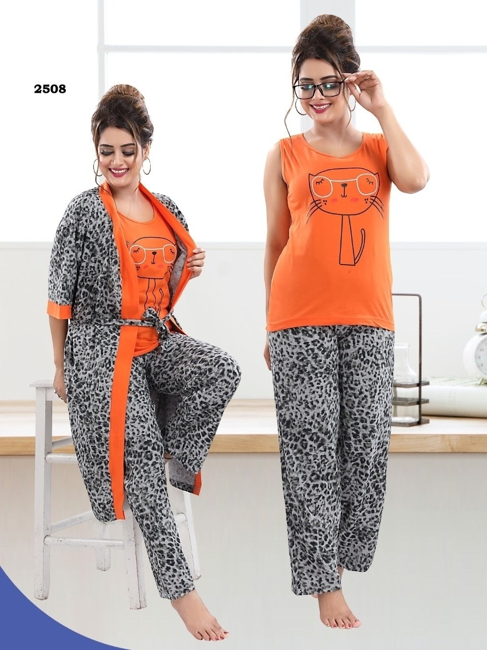 Two models wearing a three-piece cotton hosiery night suit with a light grey and orange printed jacket, sando, and pajama. The models are indoors, with one standing and posing, and the other sitting and adjusting glasses.