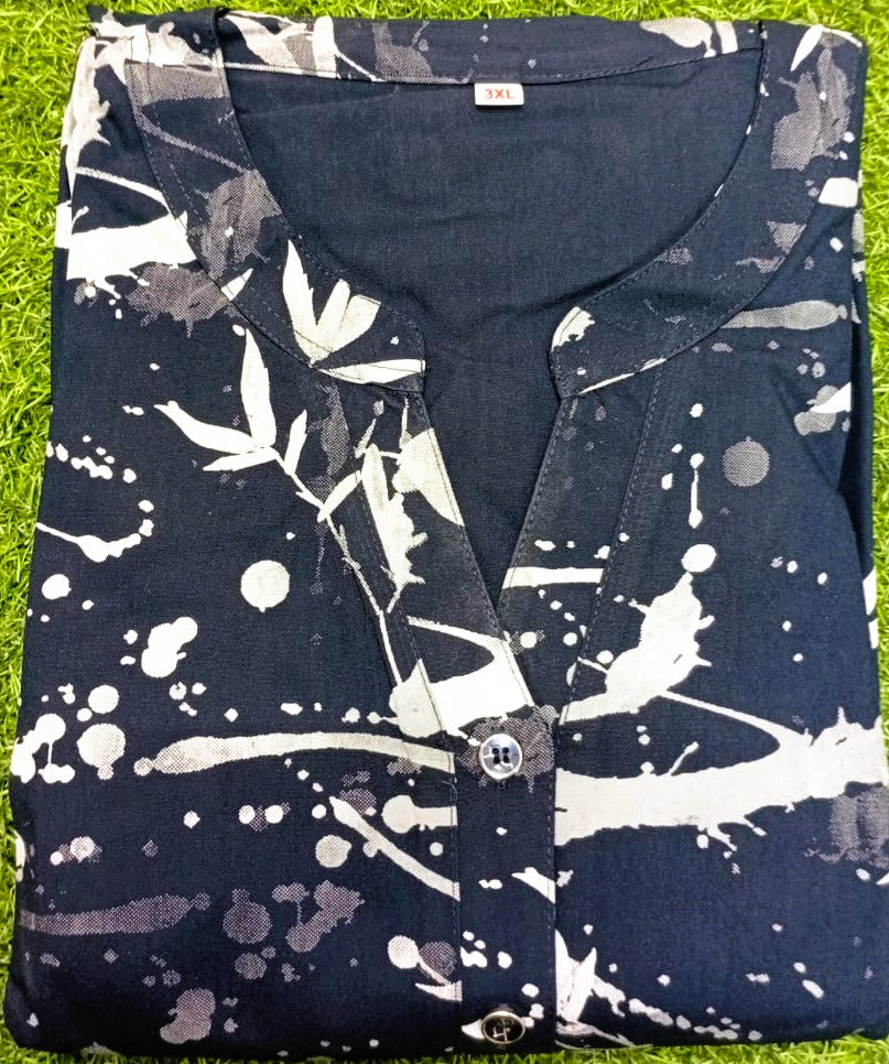 Folded shirt with abstract pattern on a grassy background