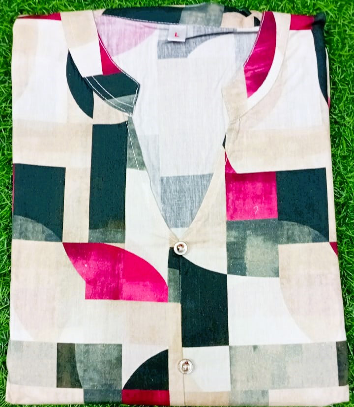 Colorful geometric-patterned shirt on a grass background