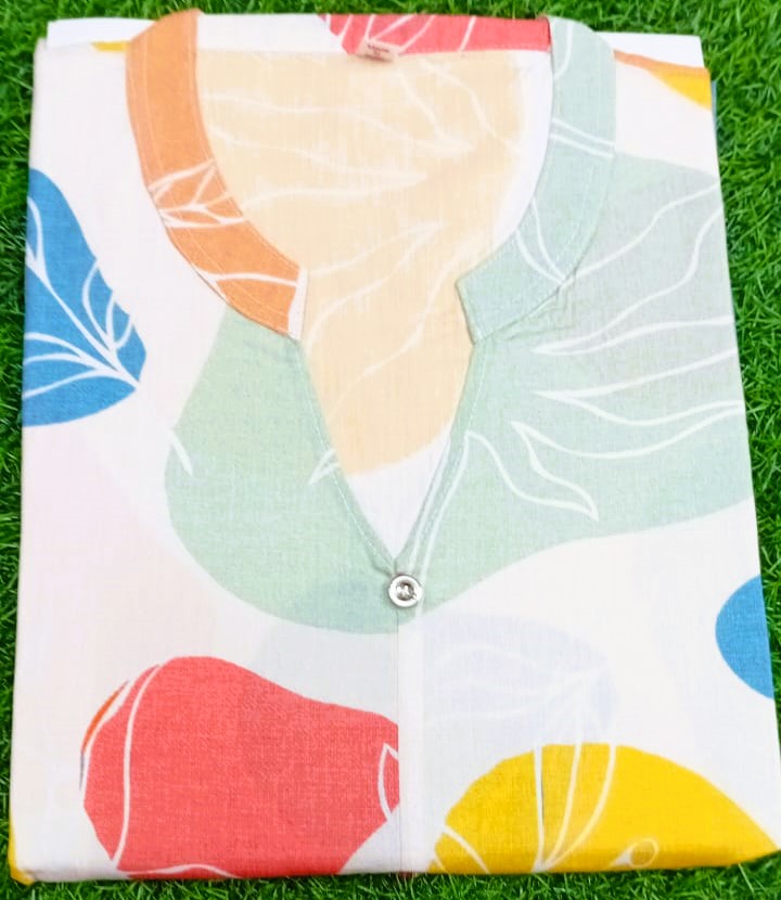 Colorful fabric with abstract patterns on a grass background