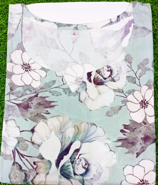 Floral-patterned fabric on a grass background