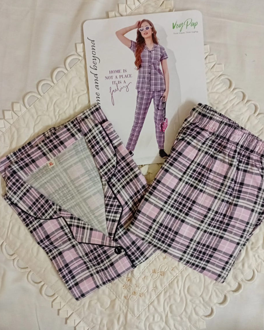 Woman wearing a checkered outfit with text 'Home is not a place, it is a feeling' on a white background.
