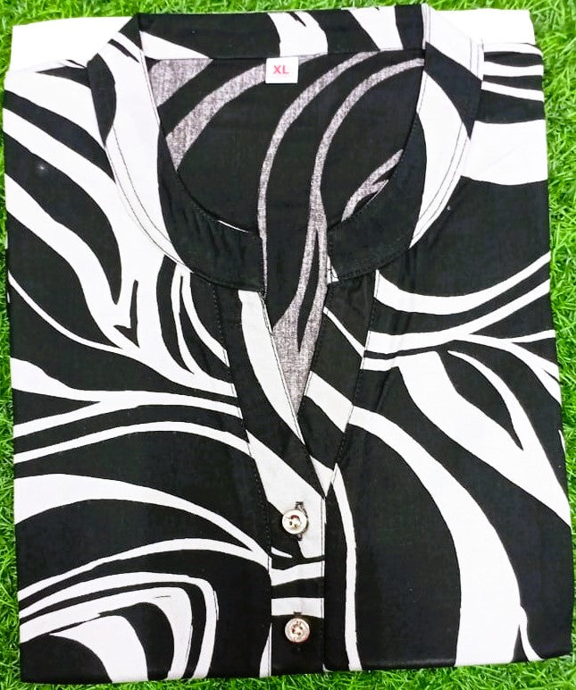 Black and white patterned shirt on a grass background