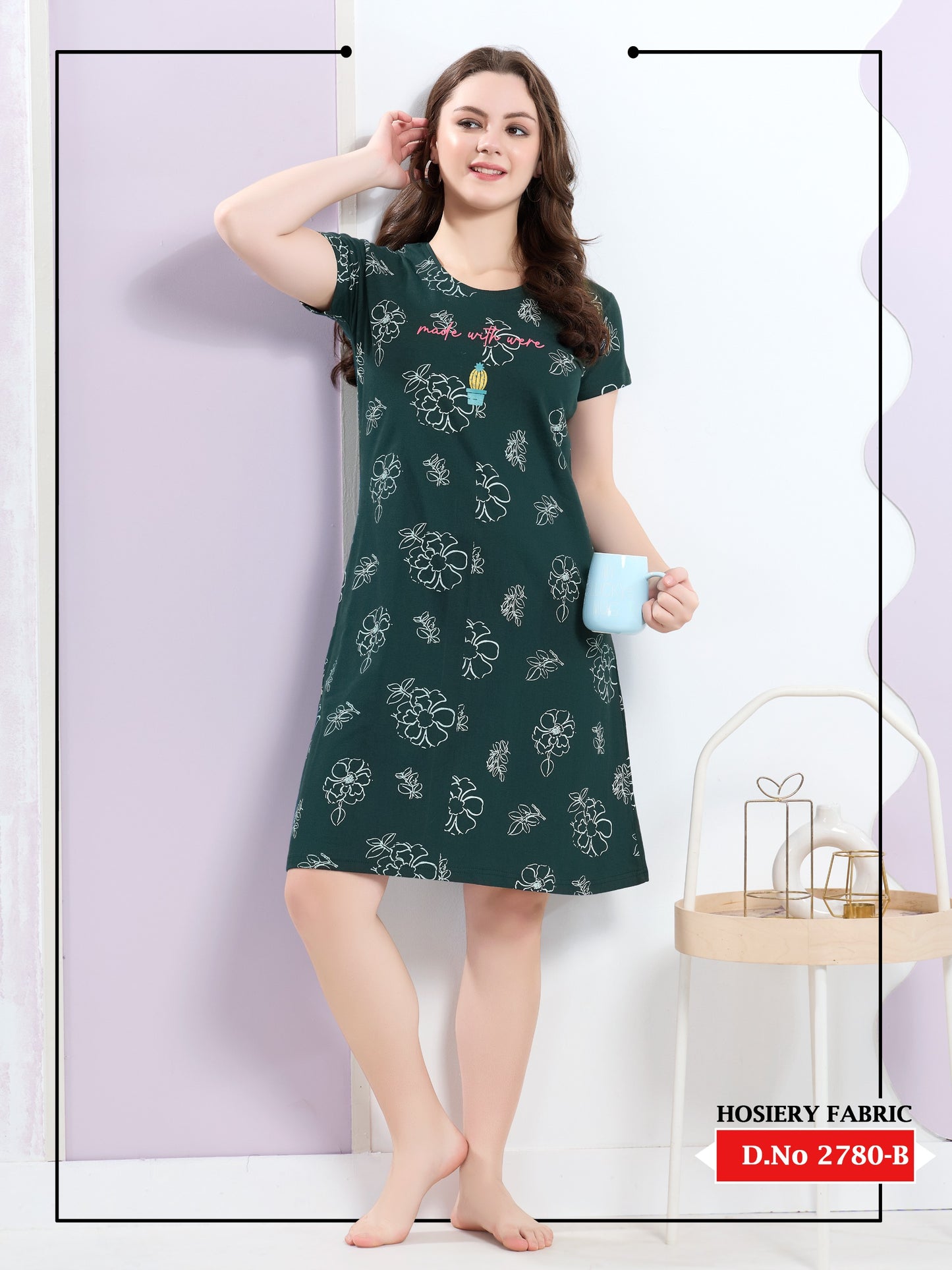 Woman wearing a green nightdress with floral patterns against a white background