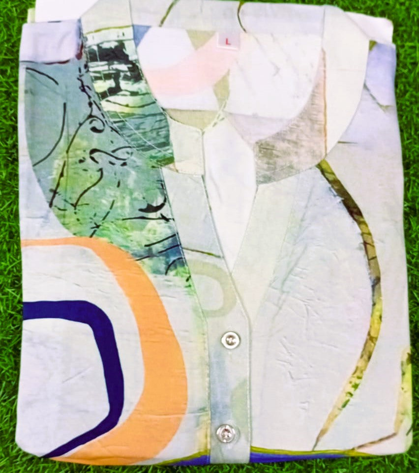 Colorful shirt with abstract patterns on a grass background
