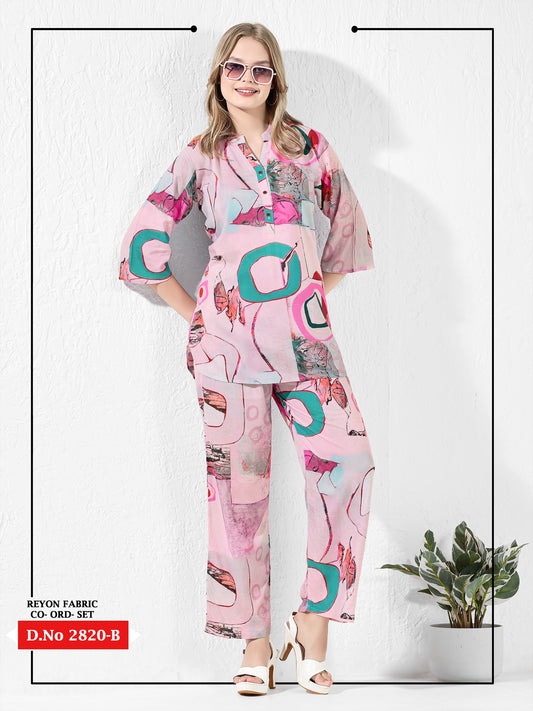 Woman wearing a pink and teal patterned outfit on a white background