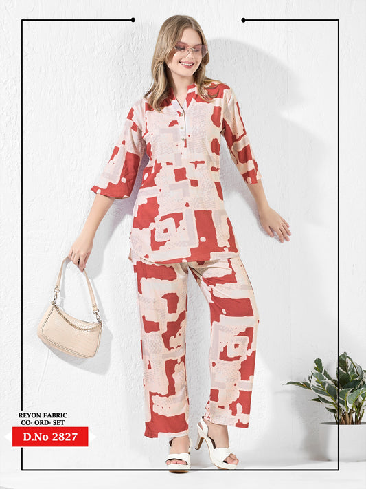 Woman wearing a red and white patterned outfit with a beige handbag on a white background