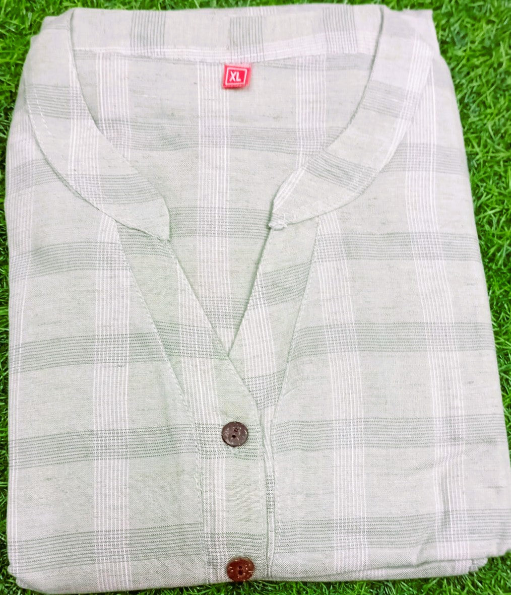 White checkered shirt with a button on grass
