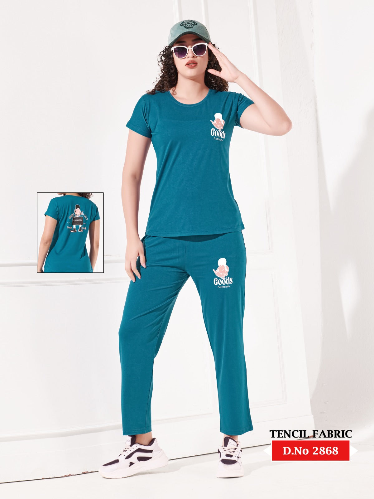 Woman wearing a teal outfit with matching cap and shoes, featuring a brand logo on a white background.