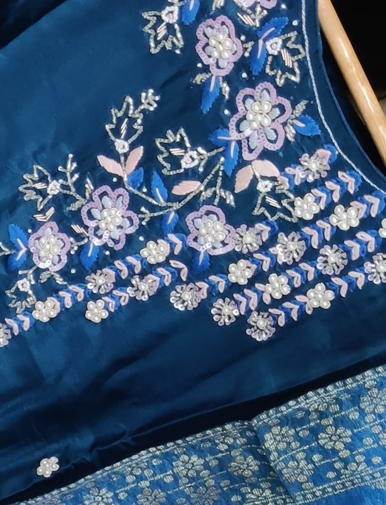 Blue fabric with floral embroidery and sequins
