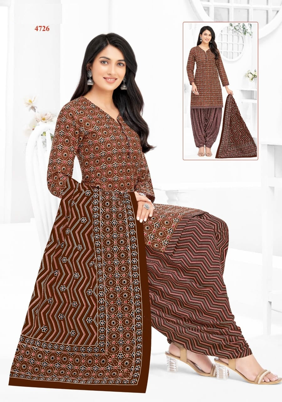 Woman wearing a brown patterned kurta with matching palazzo pants on a white background.