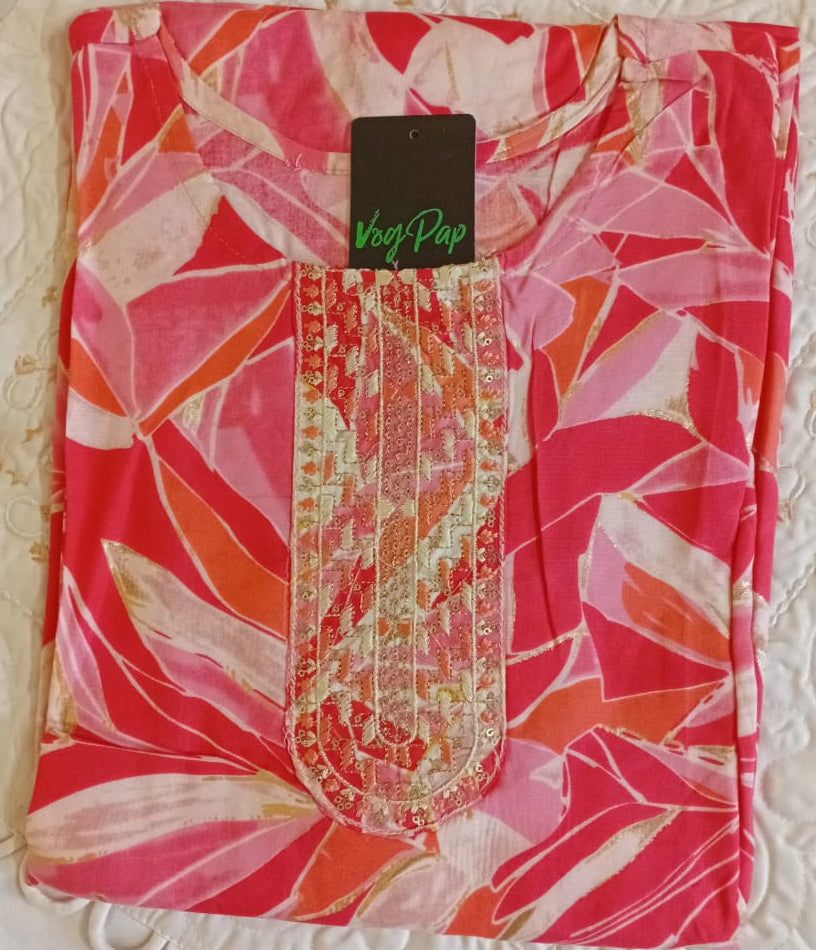 Pink floral patterned fabric with a brand tag on a textured white background