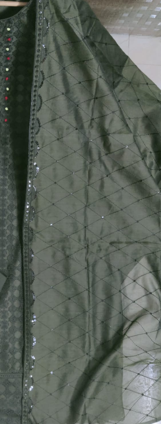 Close-up of green fabric with a textured pattern