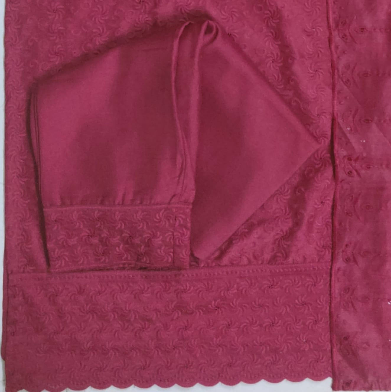 Close-up of a textured pink fabric with a hood