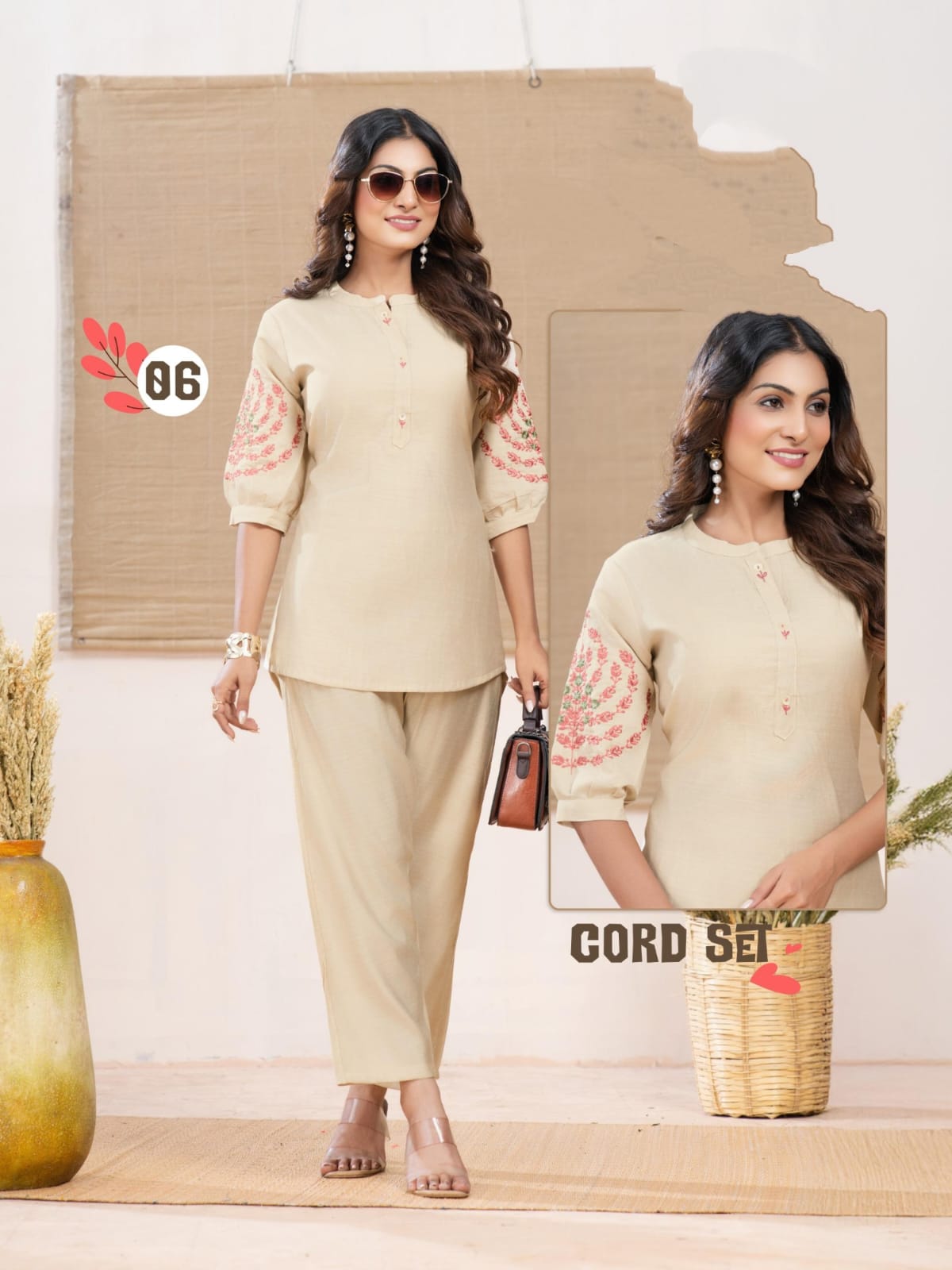 Woman wearing a beige outfit with floral sleeves in a minimalistic setting.