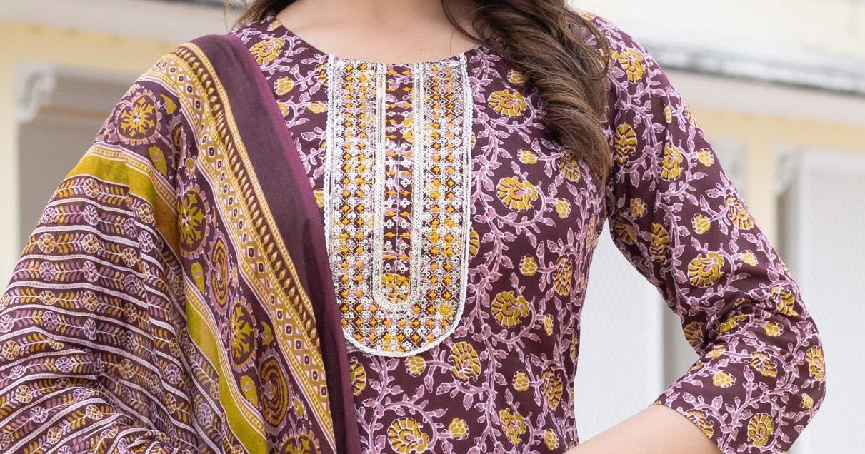 Purple traditional outfit with floral patterns and embroidery