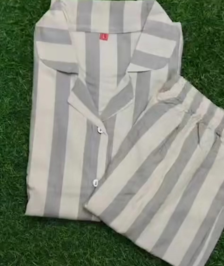 Striped shirt and pants set on a grassy background