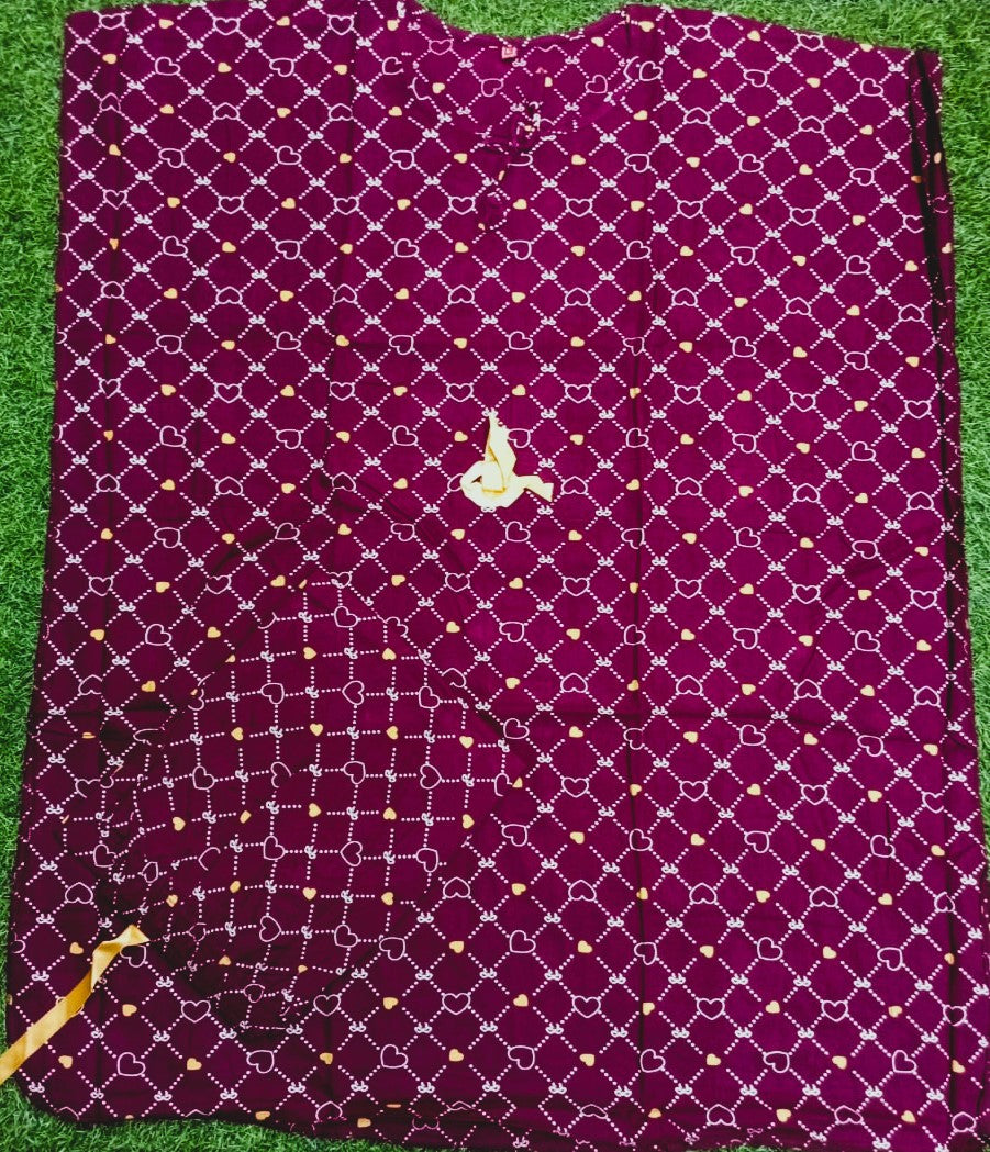 Purple fabric with a geometric pattern on a green surface