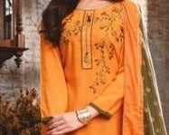 Orange traditional outfit with embroidery on a plain background