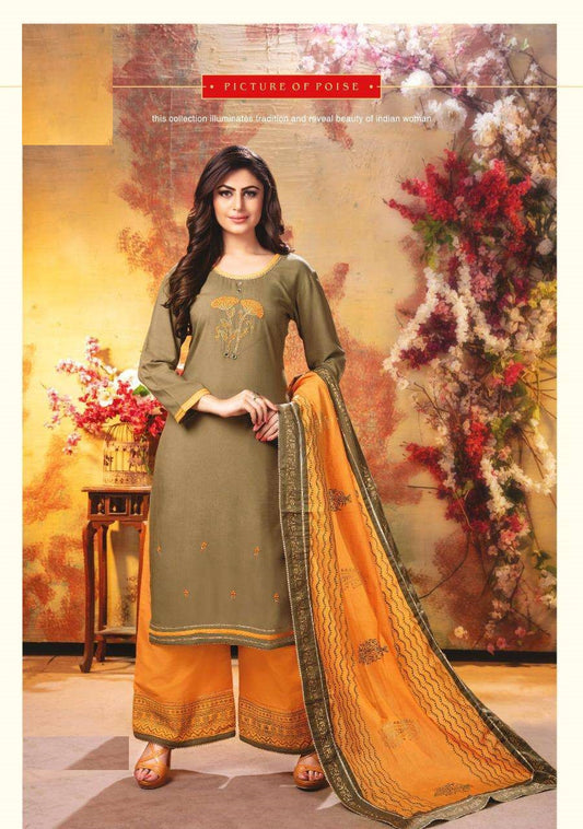 Woman wearing a green and orange traditional outfit with floral decorations in the background