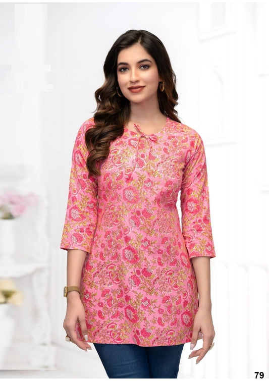 Woman wearing a pink floral dress on a white background