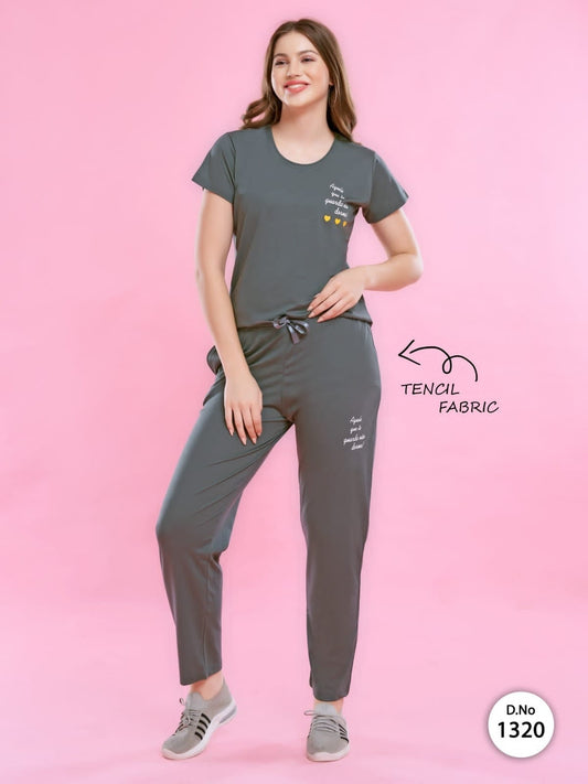A woman wearing a Tencel Buttery Super Soft Tshirt and Pant Set (TRACKSUIT) , showcasing its luxurious fabric and elegant design.