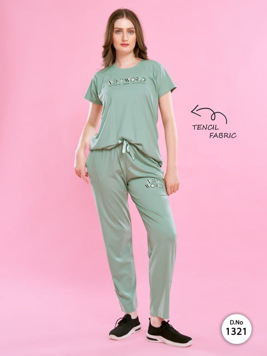 A woman wearing a Tencel Buttery Super Soft Tshirt and Pant Set (TRACKSUIT) , showcasing its luxurious fabric and elegant design.