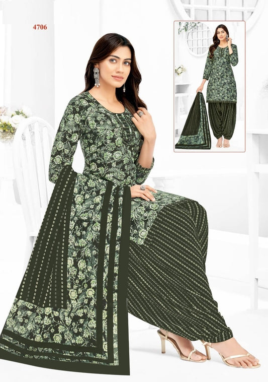 Woman wearing a green floral dress with matching dupatta on a white background