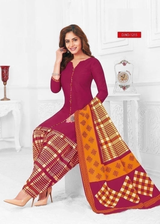A woman wearing a fully stitched cotton suit with a purple top and a multicolored dupatta.